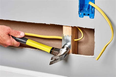 how to run wire through wall studs